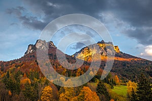 Autumn rural landscape with mountains peaks on background