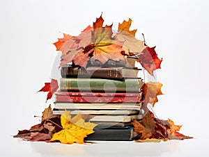 Autumn's Chapters: Stack of Worn-Out Books Marked with Vibrant Fall Leaves on a Pure White Canvas