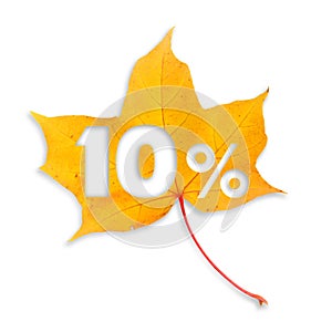 Autumn sale - 10%. Colorful maple leaf with text on white background