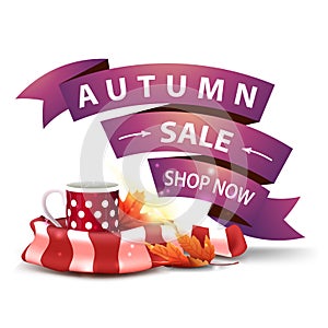 Autumn sale, discount clickable web banner in the form of ribbons with mug of hot tea and warm scarf photo