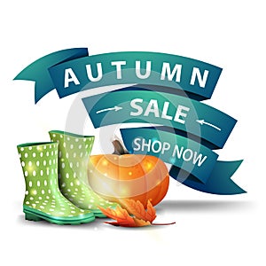 Autumn sale, discount clickable web banner in the form of ribbons with rubber boots and pumpkin photo