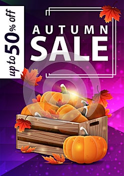 Autumn sale, purple vertical web banner with wooden crates of ripe pumpkins and autumn leaves