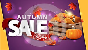 Autumn sale, purple web banner with wooden crates of ripe pumpkins and autumn leaves