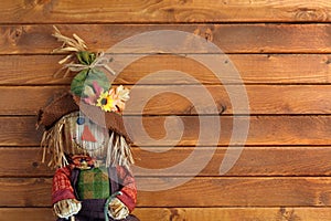 Autumn Scarecrow on wooden background