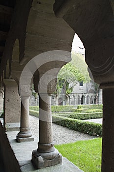 Romanesque cloister arches looking into courtyard courtyard photo