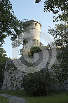 Round watch tower on city wall photo