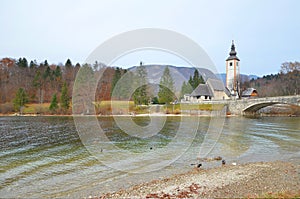 Autumn scene of Lake Bohinj with the beautiful church.