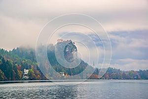 Autumn scenery of Bled lake at foggy autumn morning