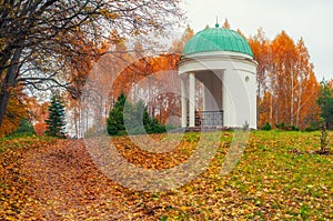 Autumn scenery with colored trees and white alcove, Arboretum Oleksandriya, Bila Tserkva, Ukraine