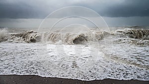 Autumn sea storm with splash from big waves at the beach