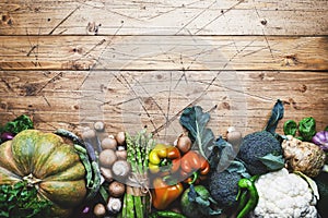 Autumn seasonal food, vegetarian cooking ingredients. Organic vegetables, pumpkin, mushrooms, asparagus, paprika, green beans on