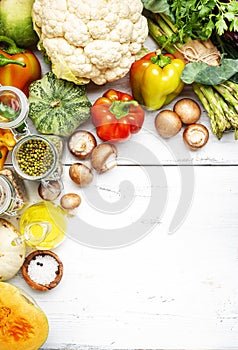 Autumn seasonal food, vegetarian cooking set. Organic vegetables, pumpkin, mushrooms, asparagus, paprika, legumes, chickpeas and