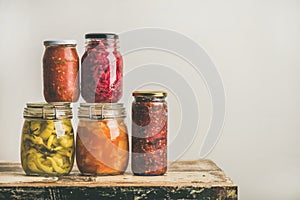 Autumn seasonal pickled or fermented vegetables in jars, copy space