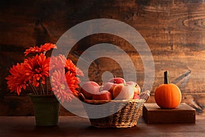 Autumn setting with apples in wicker basket