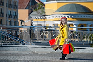 autumn shopper girl changing her wardrobe with seasonal sales. teen shopper with shopping bags outdoor. teen girl in