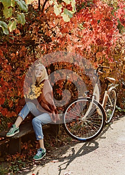 Autumn simple pleasures. Active leisure and lifestyle. Girl ride bicycle for fun. Blonde enjoy relax park. Autumn