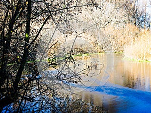 Autumn small river and the first autumn ice