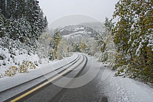 Autumn snow on mountain road
