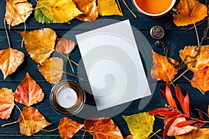 Autumn stationery mockup, a blank vertical A5 greeting card or invitation, shot from the top with a place for text