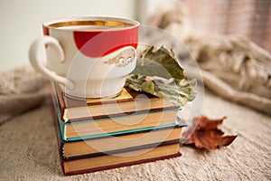 Autumn still life with books and a coffee mug. Homeliness