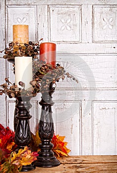 Autumn still life with candles and leaves