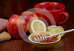 Autumn still life with honey, apples, ginger and a cup of tea stock images