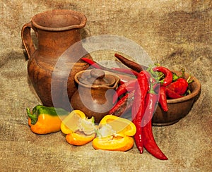 Autumn still life with peppers and pottery