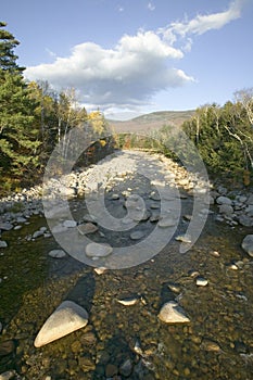 Autumn stream in Crawford Notch State Park in White Mountains of New Hampshire, New England photo