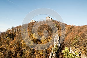 Autumn Sulovske skaly mountains with sandstone rocks, colorful forest and clear sky in Slovakia
