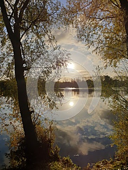 Autumn Sun setting over lake