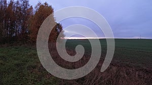 Autumn sunrise above farmland fields, time lapse