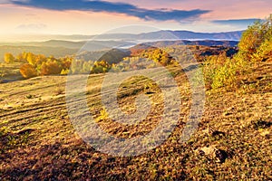 Autumn sunrise in mountainous countryside.