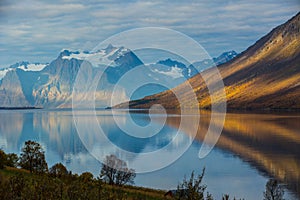 Autumn sunrise between mountains and fiords in Northern Norway photo