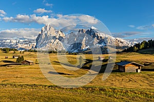 Autumn sunset at Alpe de Suisi with view at Sassolungo in Dolomites in Italy