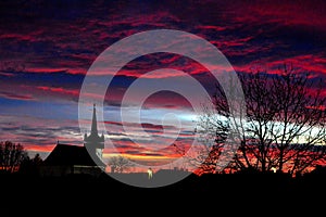 Autumn sunset with church