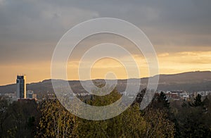 Autumn sunset with orange sky over Radvan - part of Banska Bystrica, Slovakia. View on office building