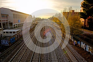 Autumn sunset, view of train tracks near Alcala de Henares station, Madird, Spain