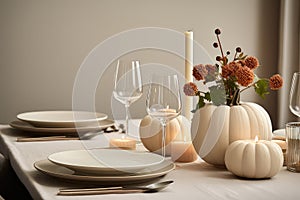 Autumn Table Setting Featuring Mini White Pumpkins, Ceramic Plates, Candles, And Napkins