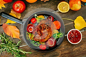 Autumn table setting with pumpkins. Thanksgiving dinner.baked pork shank with vegetables