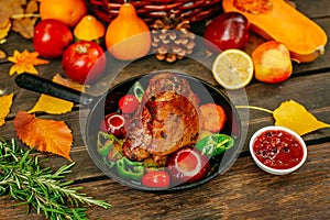 Autumn table setting with pumpkins. Thanksgiving dinner.baked pork shank with vegetables