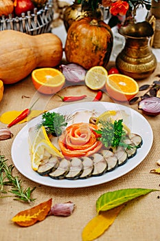 Autumn table setting with pumpkins. Thanksgiving dinner. fish platter with lemon in a white plate