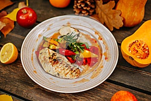 Autumn table setting with pumpkins. Thanksgiving dinner.grilled chicken breast with vegetables