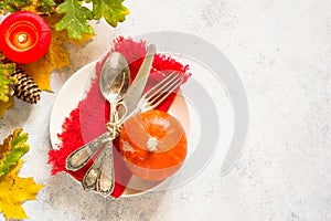 Autumn table setting top view at white table.
