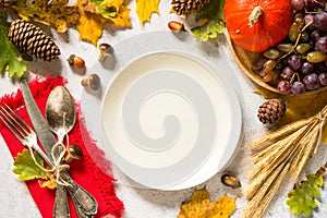 Autumn table setting top view at white table.
