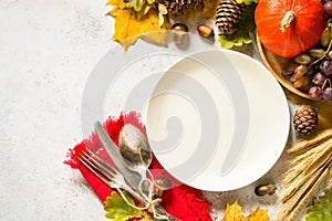 Autumn table setting top view at white table.