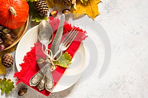 Autumn table setting top view at white table.
