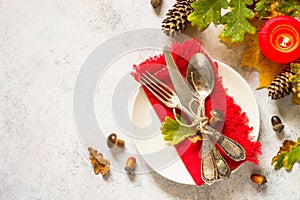 Autumn table setting top view at white table.