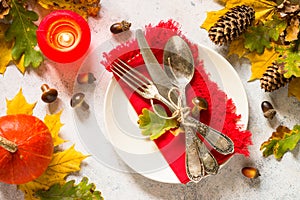 Autumn table setting top view at white table.