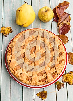 Autumn tart with apples, pears and quince