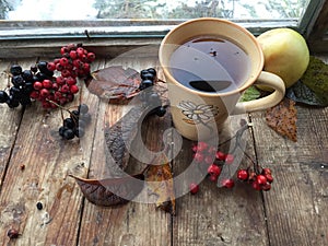 Autumn tea on a rustic wooden background